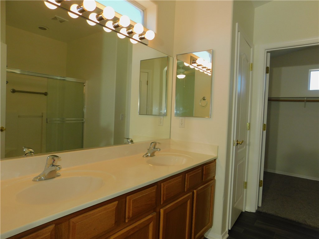 2449 Wilder Road Bullhead City, AZ 86442 - Photo 34 of 45 a bathroom with a sink and a mirror