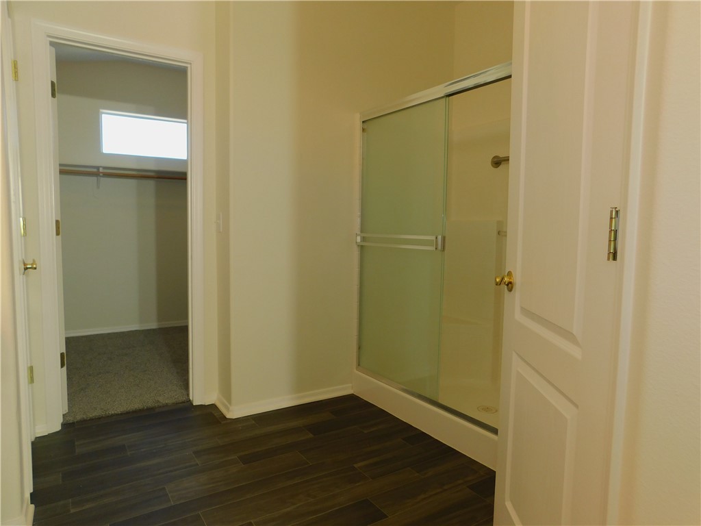2449 Wilder Road Bullhead City, AZ 86442 - Photo 35 of 45 a view of an empty room with wooden floor and closet