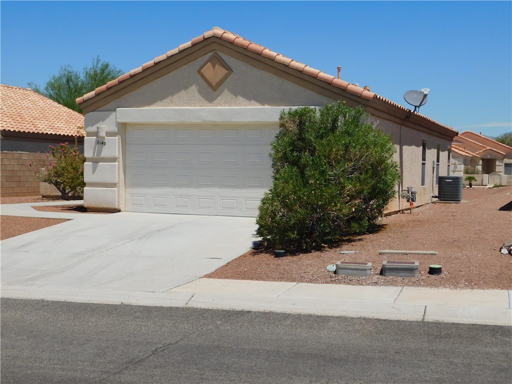 2449 Wilder Road Bullhead City, AZ 86442 - Photo 9 of 45 front view of a house with a street