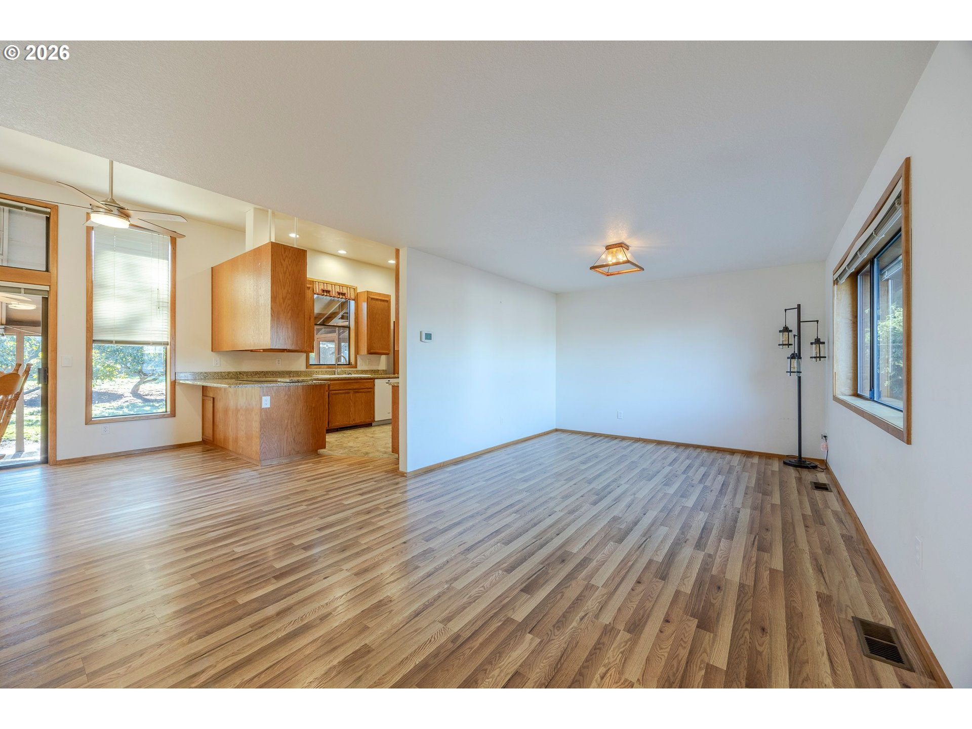 3248 West 15th Avenue Eugene, OR 97402 - Photo 17 of 33 a view of empty room with wooden floor and windows