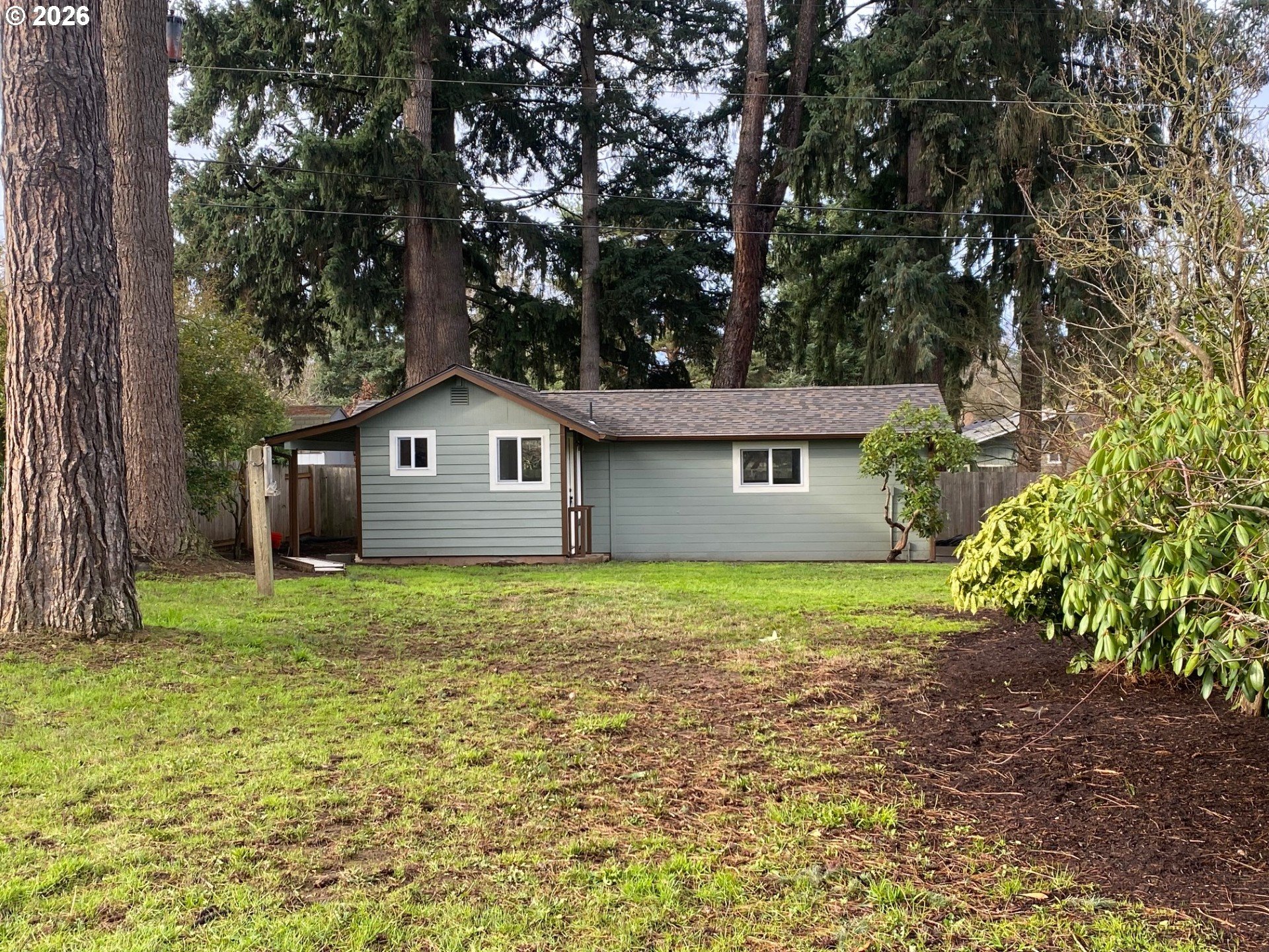 3248 West 15th Avenue Eugene, OR 97402 - Photo 10 of 33 a house with a tree in front of it