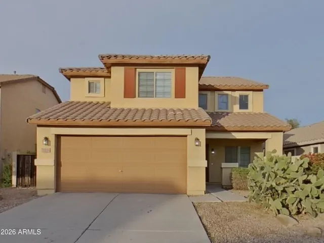 a view of a house with a garage