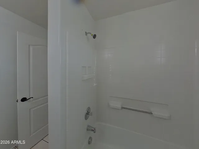 a view of an empty room and a window