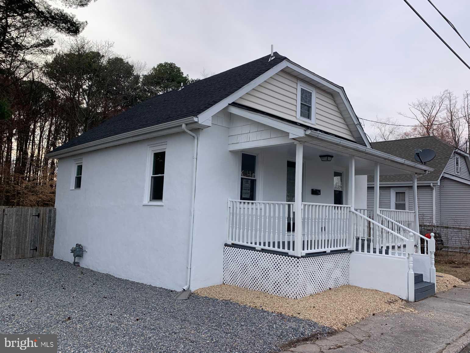12 Johnson Avenue Seaford, DE 19973 - Photo 2 of 16 a front view of a house with a yard