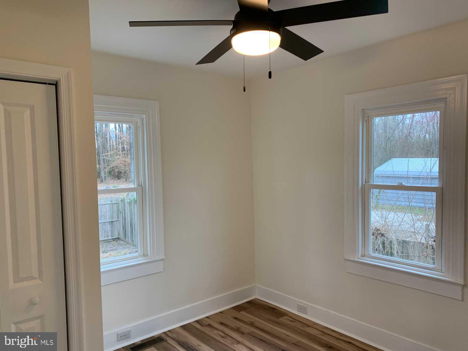 12 Johnson Avenue Seaford, DE 19973 - Photo 10 of 16 a view of an empty room with wooden floor and a window