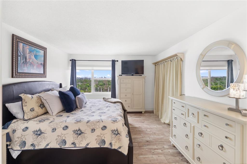 1750 Benjamin Franklin Drive, Unit 6G Sarasota, FL 34236 - Photo 24 of 82 a bedroom with a large bed and a window