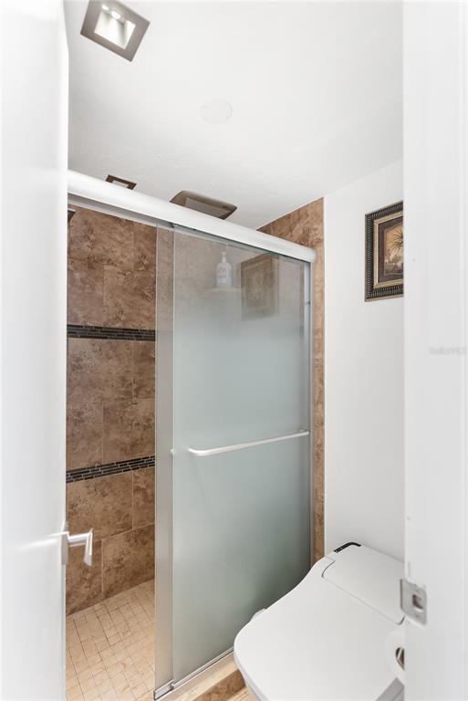 1750 Benjamin Franklin Drive, Unit 6G Sarasota, FL 34236 - Photo 27 of 82 a bathroom with a toilet and a shower