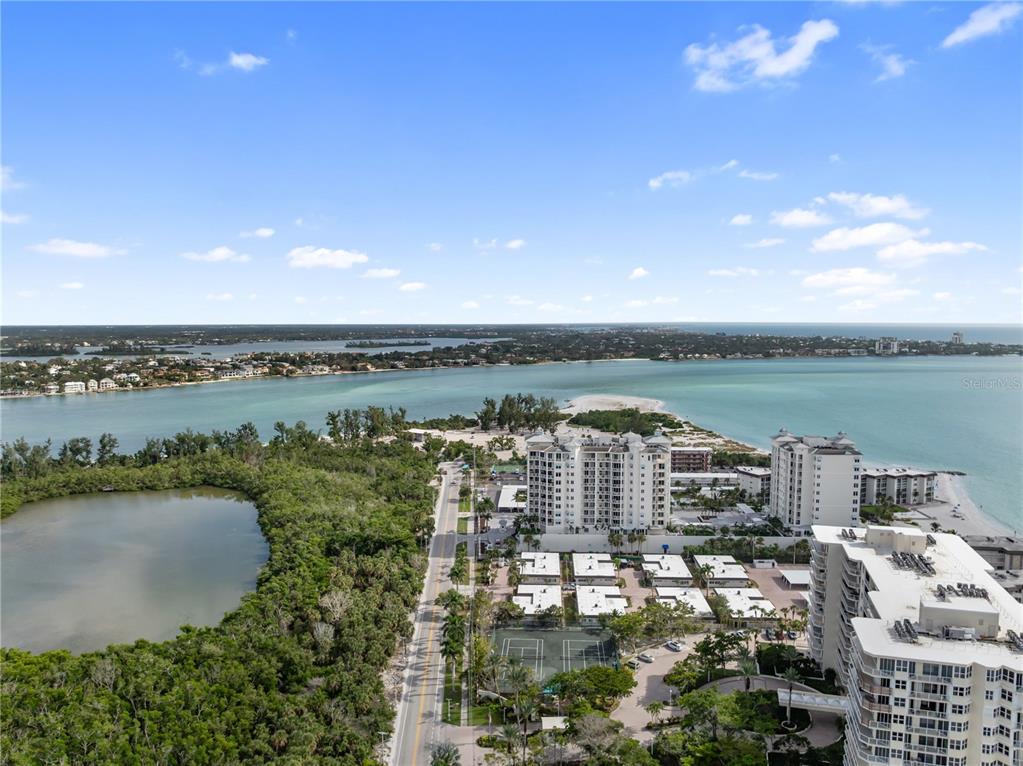 1750 Benjamin Franklin Drive, Unit 6G Sarasota, FL 34236 - Photo 64 of 82 a view of a lake with a city view