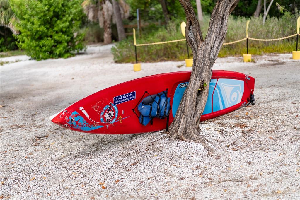 1750 Benjamin Franklin Drive, Unit 6G Sarasota, FL 34236 - Photo 77 of 82 a view of outdoor space with shower and trees