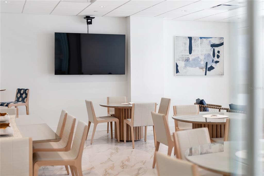 1750 Benjamin Franklin Drive, Unit 6G Sarasota, FL 34236 - Photo 10 of 82 a dining room with furniture and wooden floor