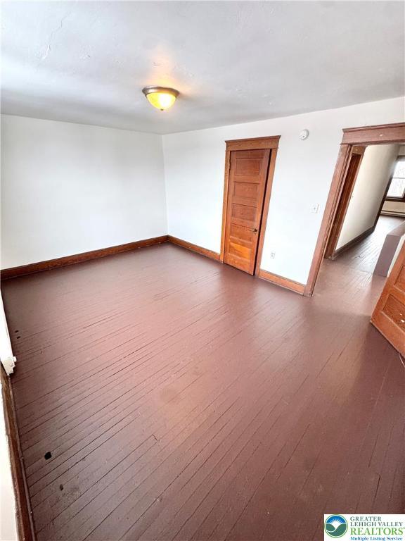 819 East 5th Street, Unit 2 Bethlehem, PA 18015 - Photo 15 of 19 a view of an empty room with wooden floor and a window
