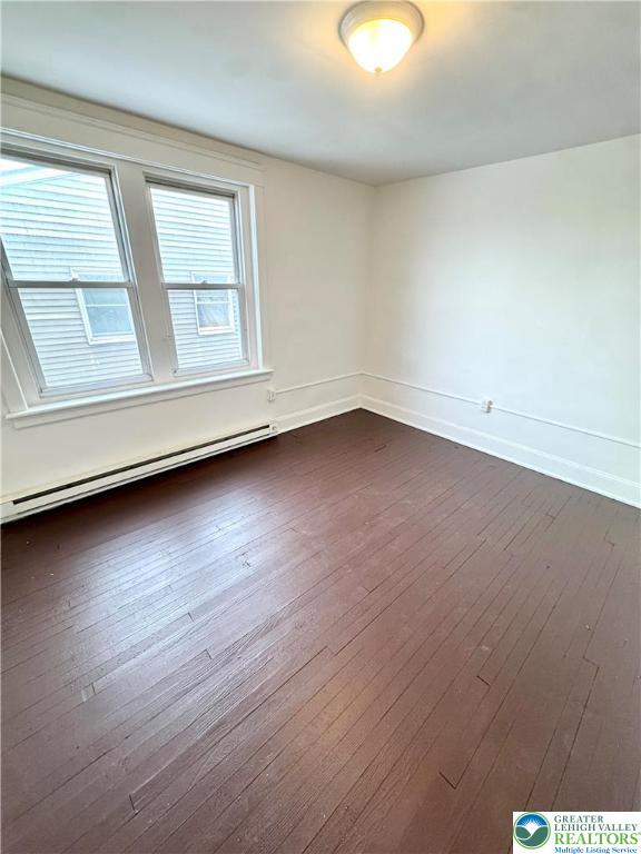 819 East 5th Street, Unit 2 Bethlehem, PA 18015 - Photo 4 of 19 an empty room with wooden floor and windows