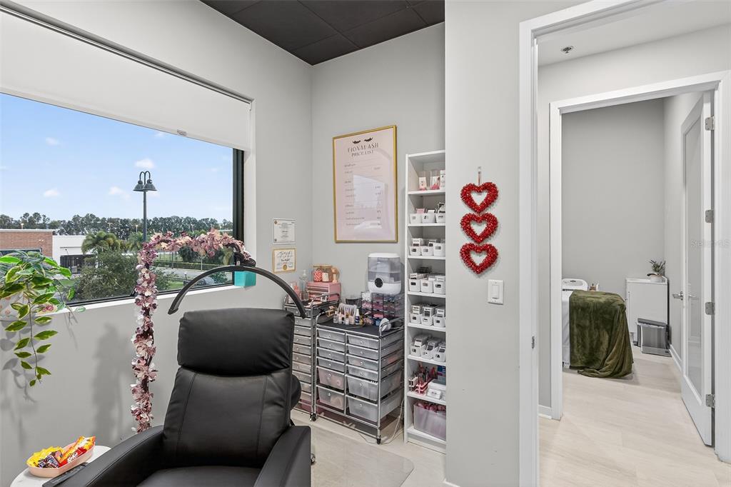 1711 Amazing Way, Unit 201 Ocoee, FL 34761 - Photo 6 of 15 a living room with furniture and flowers