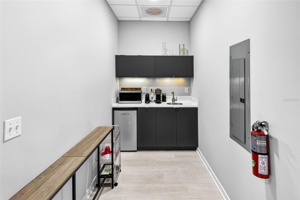 1711 Amazing Way, Unit 201 Ocoee, FL 34761 - Photo 9 of 15 a kitchen with stainless steel appliances a sink and cabinets