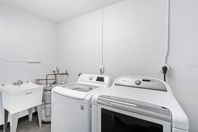 a utility room with dryer and washer