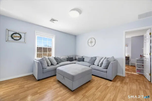 a living room with furniture and a window