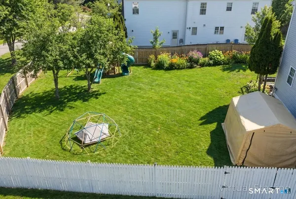 a view of a backyard with a garden and plants