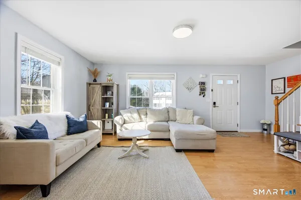 a living room with furniture and a large window