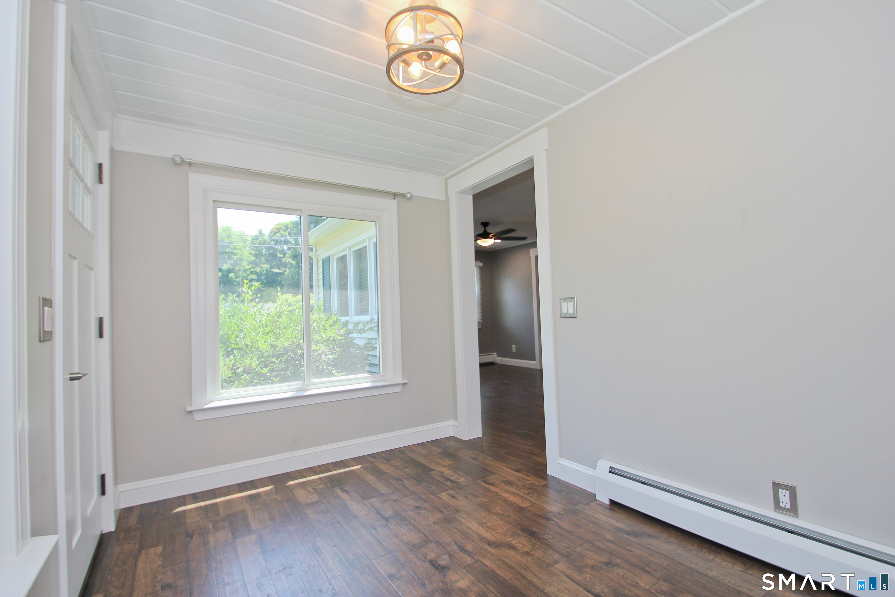 5 R Broad Hill Road Granby, CT 06090 - Photo 21 of 31 an empty room with wooden floor and windows