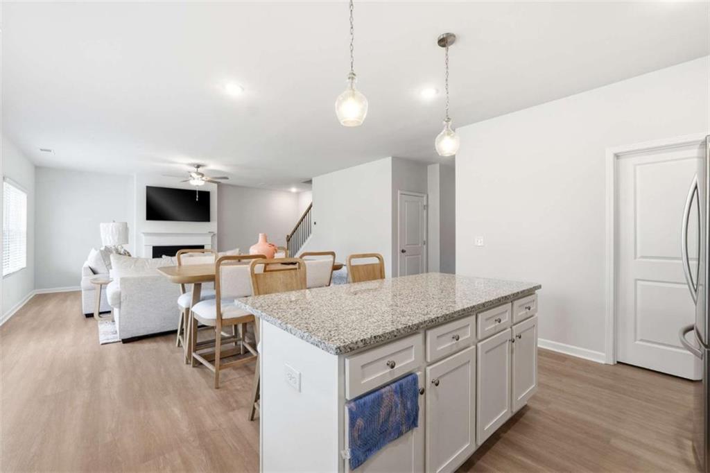 11817 Rizvan Place Covington, GA 30014 - Photo 15 of 40 a kitchen with furniture and view of living room