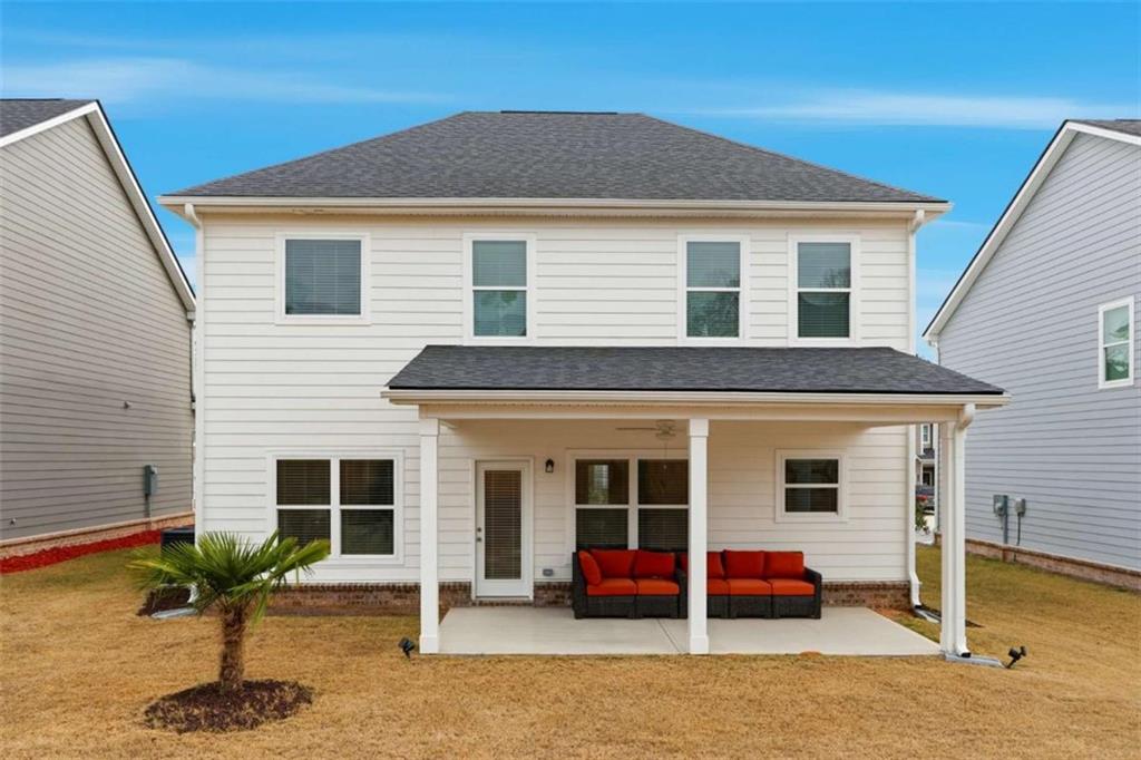 11817 Rizvan Place Covington, GA 30014 - Photo 40 of 40 a view of a house with a patio