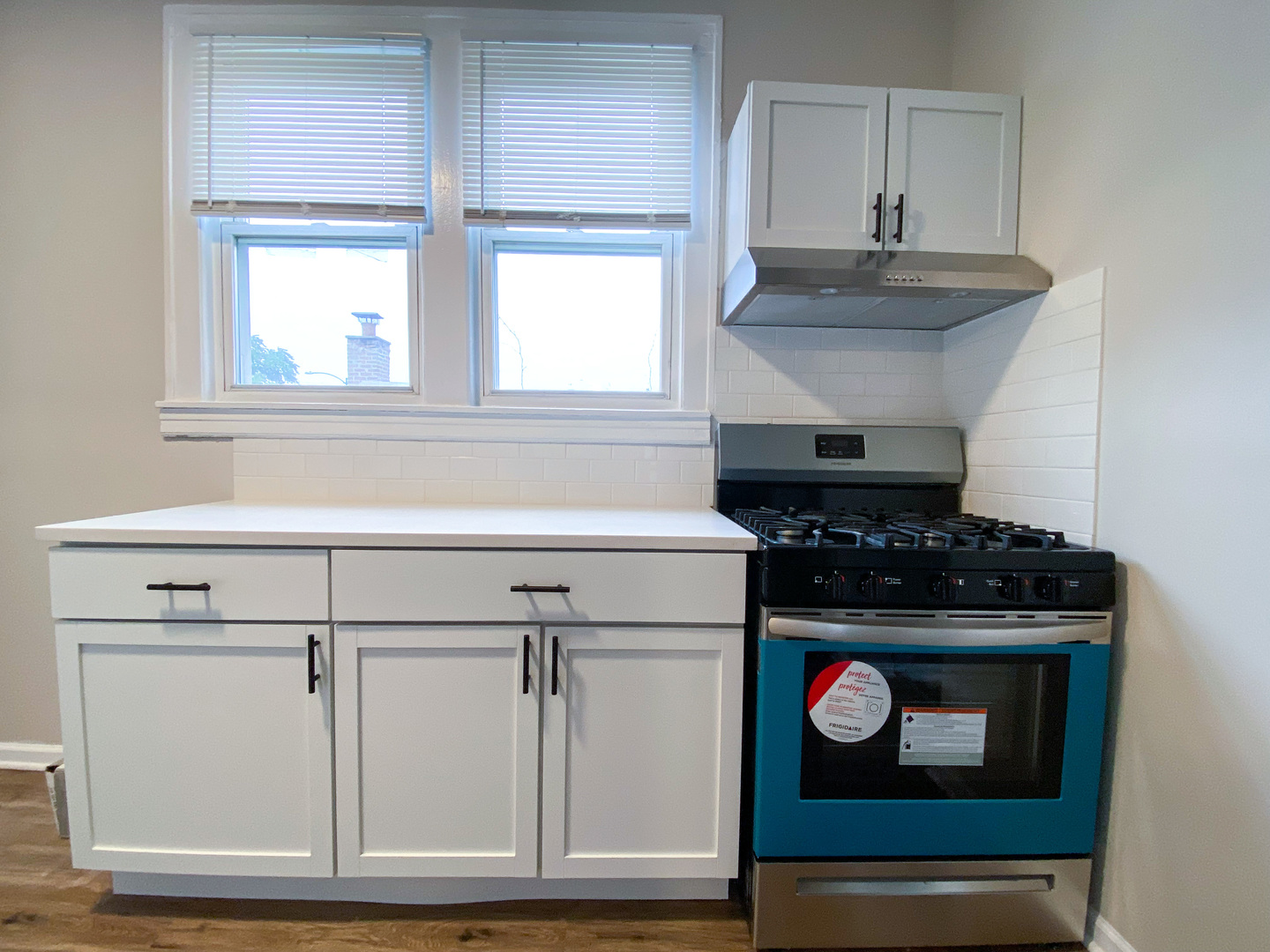 8933 South Halsted Street Chicago, IL 60620 - Photo 7 of 10 a stove top oven sitting inside of a kitchen