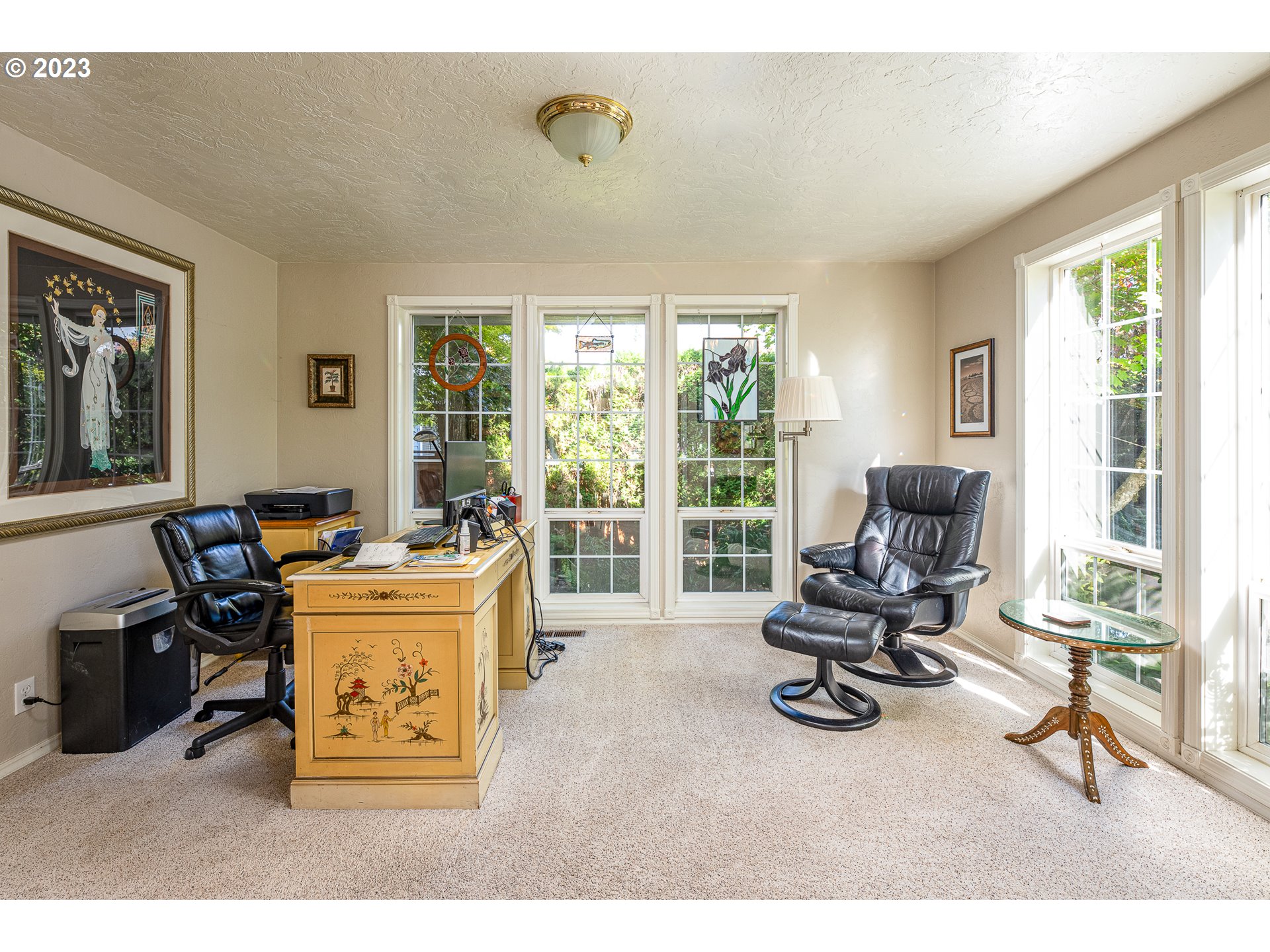 6796 F Street Springfield, OR 97478 - Photo 7 of 35 a living room with furniture a flat screen tv and a large window