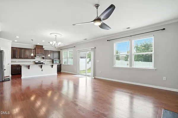 a view of a kitchen with a stove cabinets and wooden floor