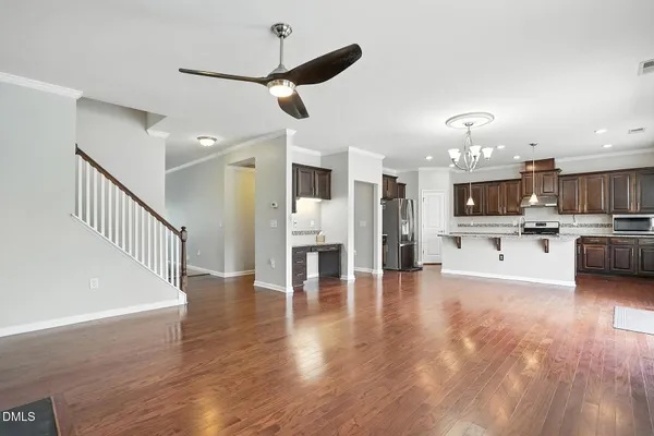 a view of kitchen with cabinets and wooden floor