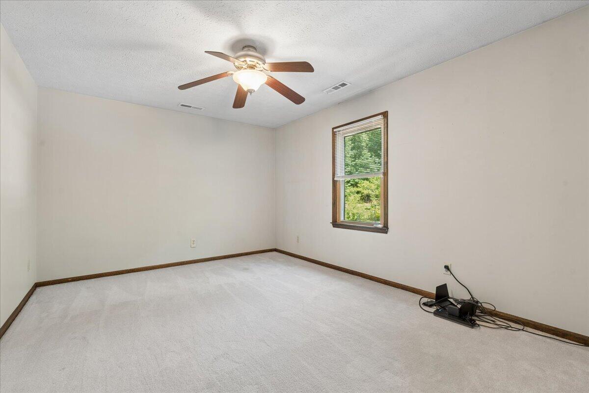431 Langdon Road Evington, VA 24550 - Photo 24 of 54 a view of room with window and ceiling fan