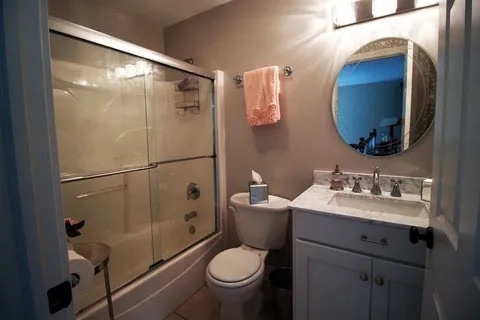 2522 Reflections Drive Crest Hill, IL 60403 - Photo 17 of 18 a bathroom with a toilet sink and mirror