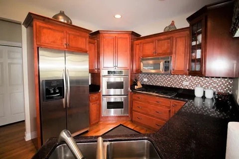 2522 Reflections Drive Crest Hill, IL 60403 - Photo 6 of 18 a kitchen with stainless steel appliances granite countertop a refrigerator and a more cabinets