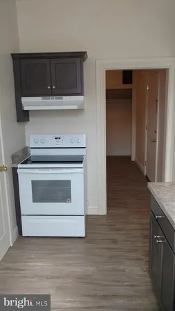 a kitchen with a stove and cabinets