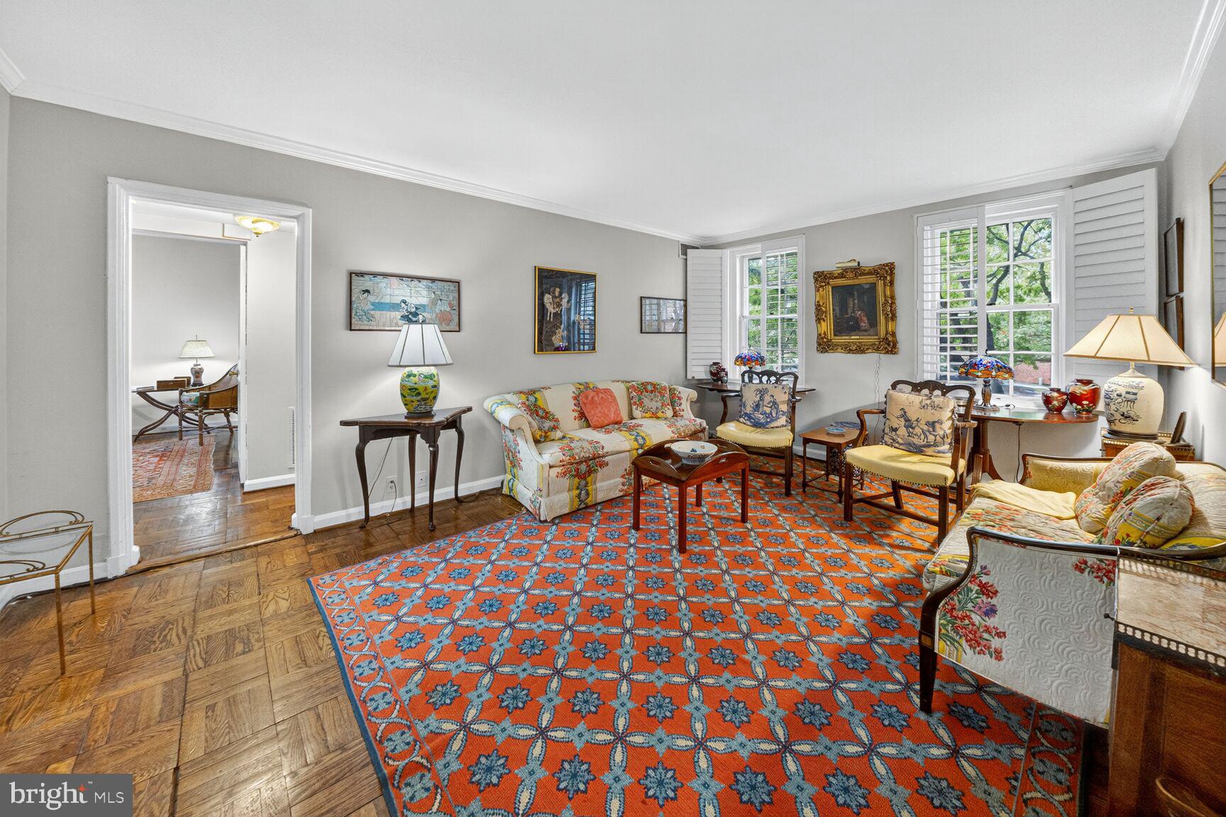 a living room with furniture and a rug