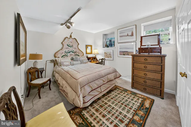 a bedroom with a bed and furniture