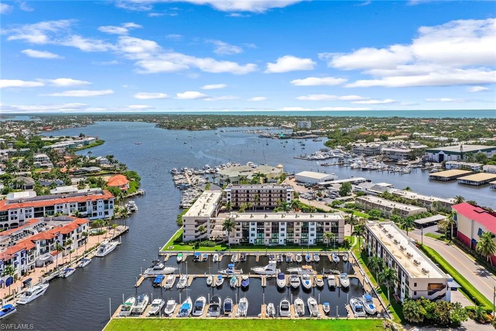 807 River Point Drive, Unit 102D Naples, FL 34102 - Photo 1 of 32 a view of a city with lots of trees