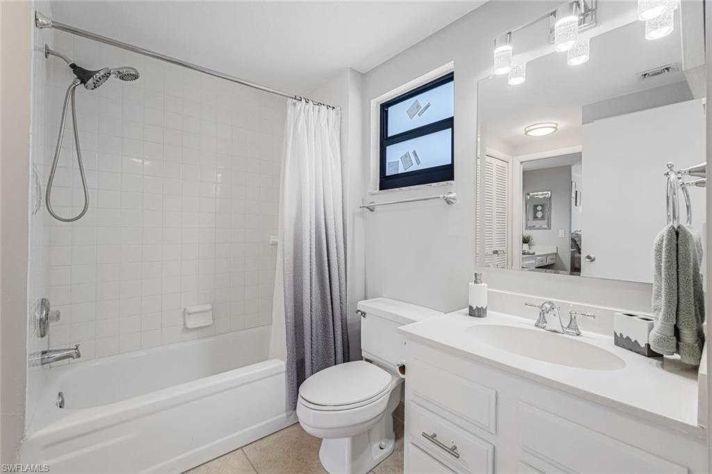 807 River Point Drive, Unit 102D Naples, FL 34102 - Photo 16 of 32 a bathroom with a sink toilet and shower