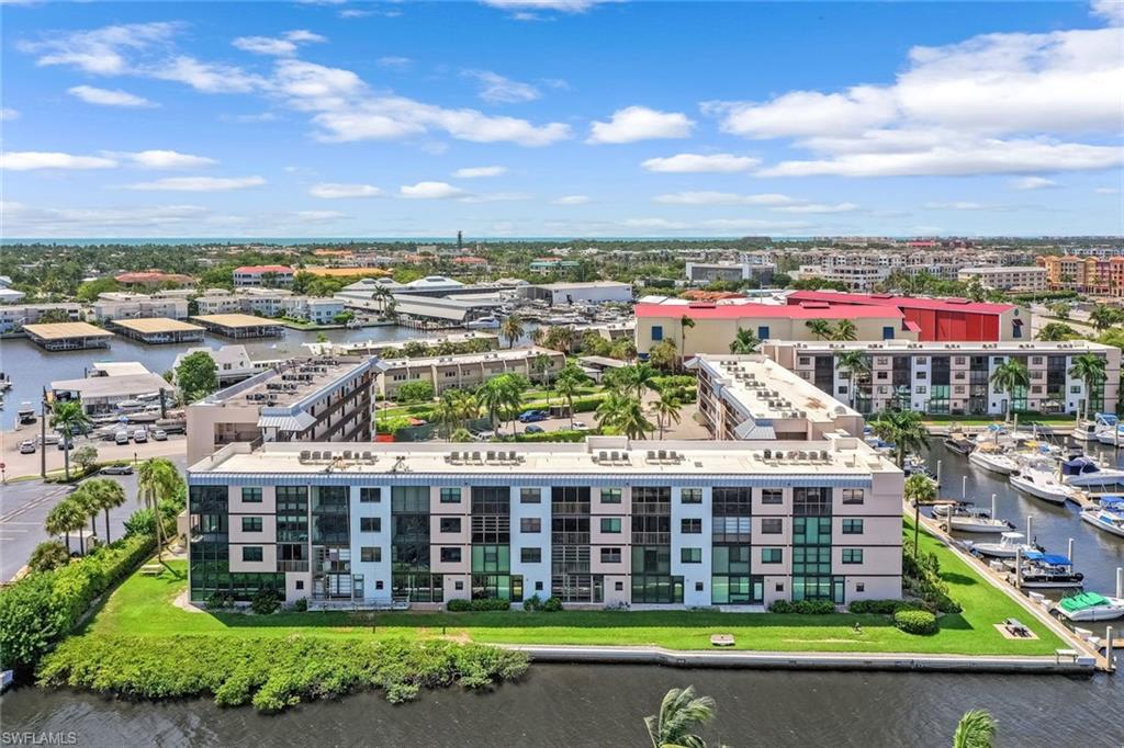 807 River Point Drive, Unit 102D Naples, FL 34102 - Photo 26 of 32 a view of a city with tall buildings