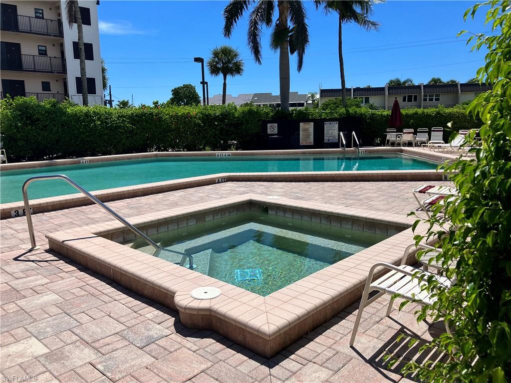 807 River Point Drive, Unit 102D Naples, FL 34102 - Photo 32 of 32 a view of a chairs and dinning table in the patio