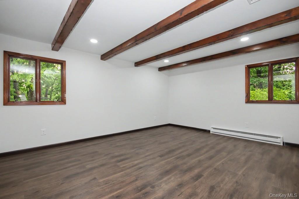 18 Hillside View Road Mahopac, NY 10541 - Photo 31 of 42 a view of an empty room with wooden floor and a window