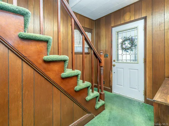 a view of entryway and hall with a window