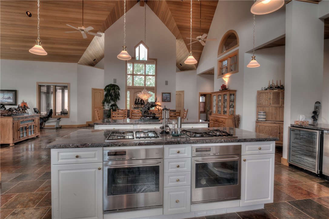 1996 Rodeo Drive Silverthorne, CO 80498 - Photo 17 of 35 a kitchen with stainless steel appliances granite countertop a stove a sink and a microwave