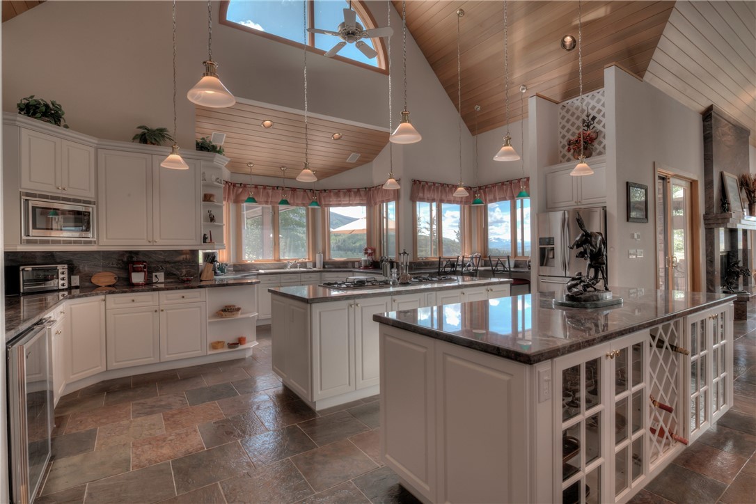 1996 Rodeo Drive Silverthorne, CO 80498 - Photo 20 of 35 a kitchen with stainless steel appliances granite countertop a white cabinets a stove top oven a sink and dishwasher