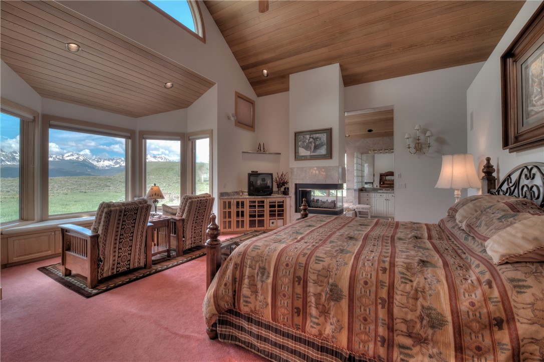 1996 Rodeo Drive Silverthorne, CO 80498 - Photo 27 of 35 a spacious bedroom with a bed and glass walk in closet