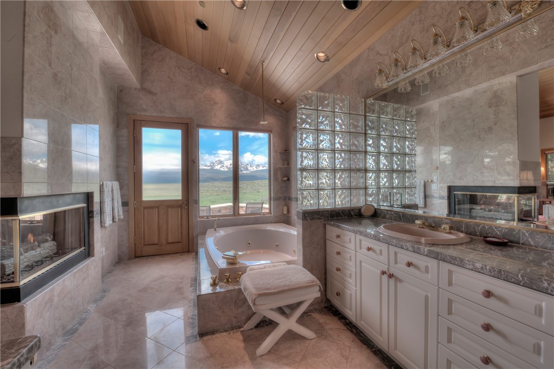 1996 Rodeo Drive Silverthorne, CO 80498 - Photo 30 of 35 a spacious bathroom with a granite countertop sink a toilet and bathtub
