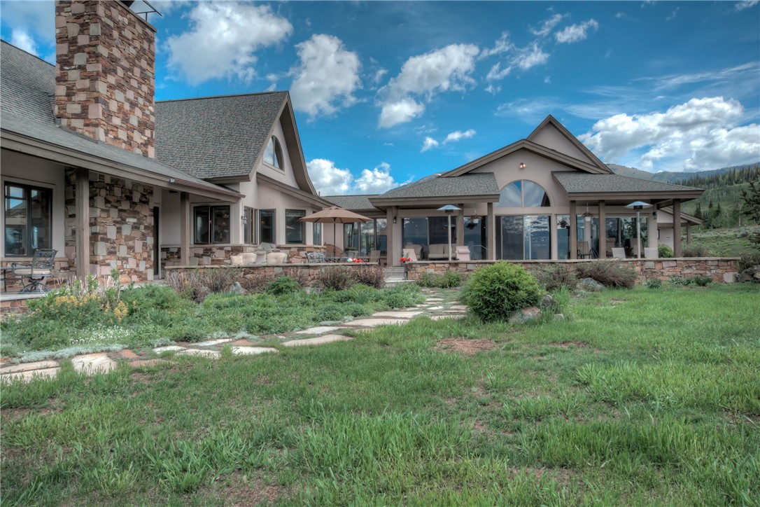 1996 Rodeo Drive Silverthorne, CO 80498 - Photo 5 of 35 a front view of a house with a yard table and chairs