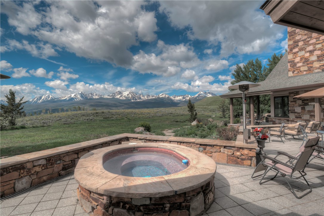 1996 Rodeo Drive Silverthorne, CO 80498 - Photo 10 of 35 a view of a swimming pool and lounge chairs in back of the house