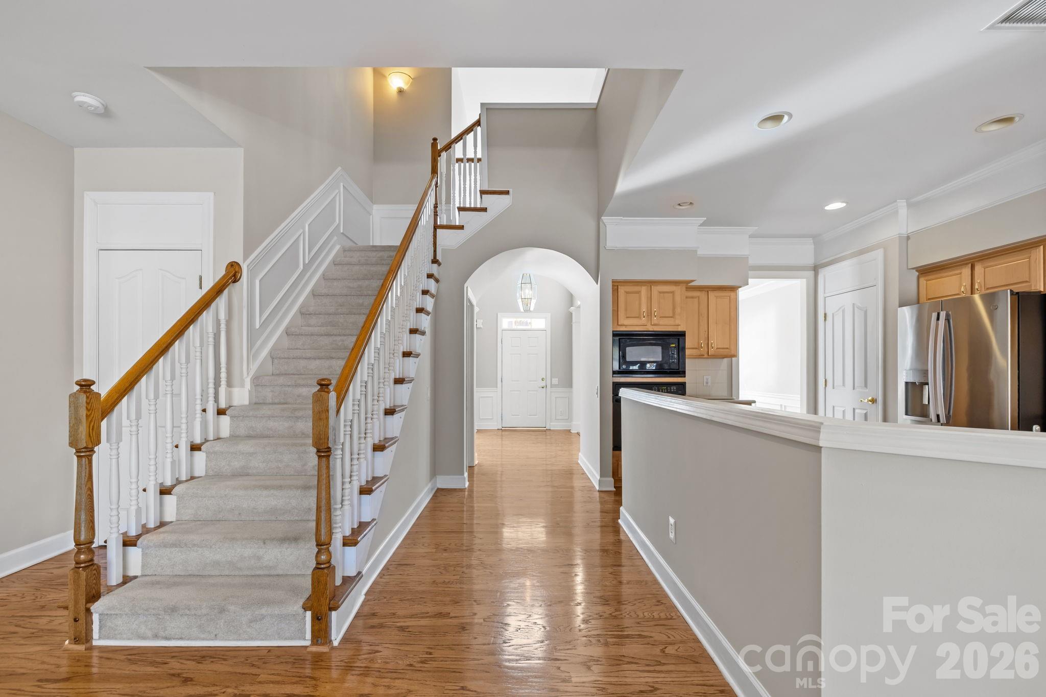 412 Eberle Way Matthews, NC 28105 - Photo 13 of 43 a view of entryway and hall with wooden floor