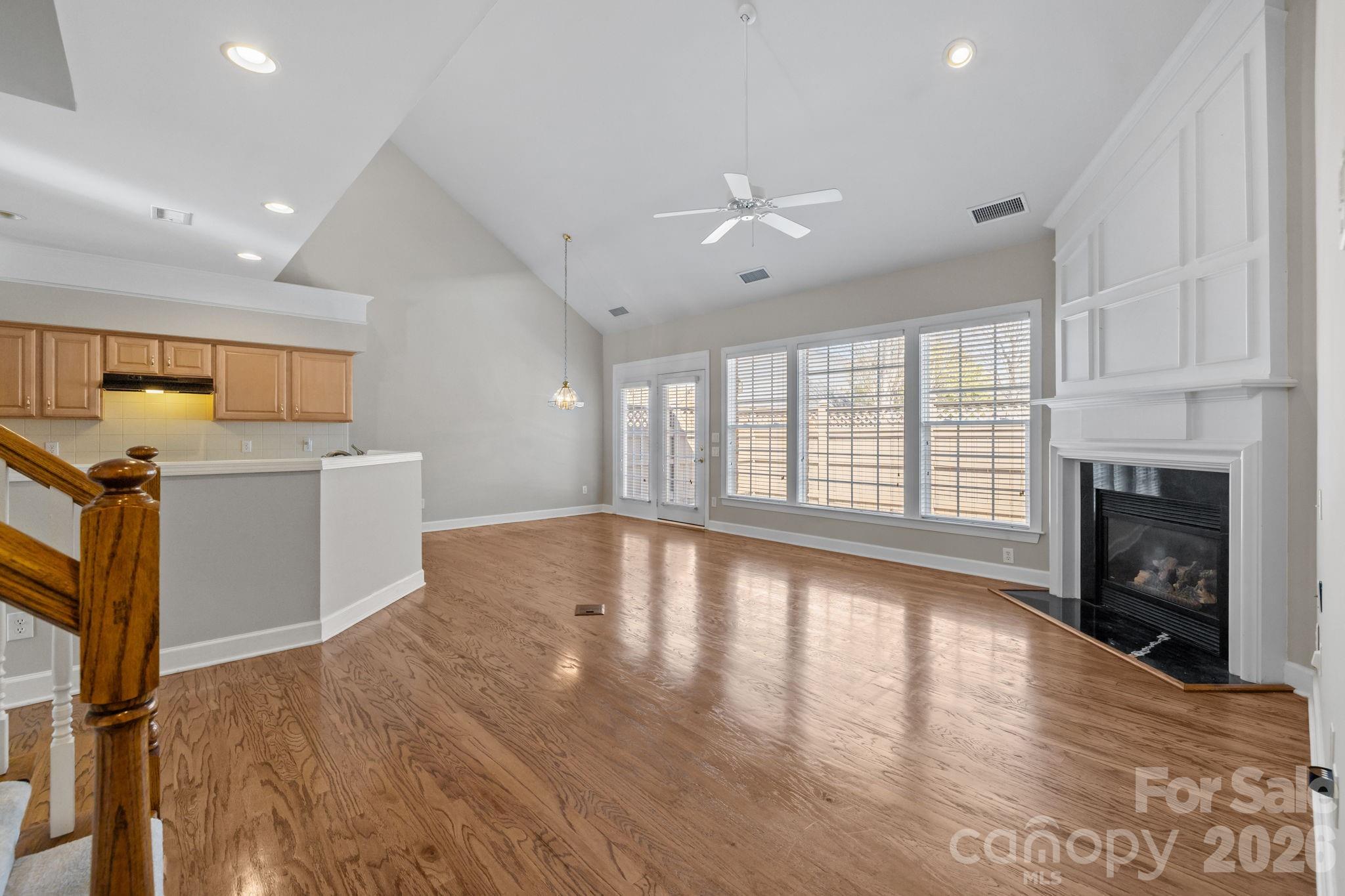 412 Eberle Way Matthews, NC 28105 - Photo 19 of 43 a view of an empty room with a fireplace and a window
