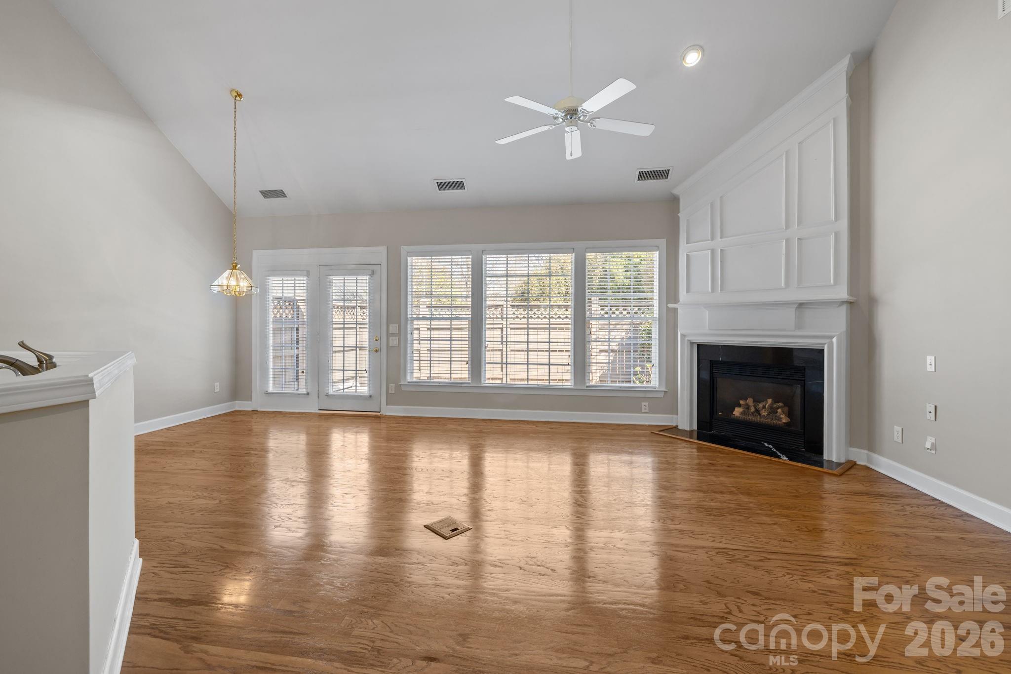 412 Eberle Way Matthews, NC 28105 - Photo 20 of 43 a view of an empty room with window and fire place